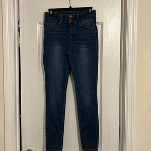 High waist stretch jeans with adjustable waist slimming band.